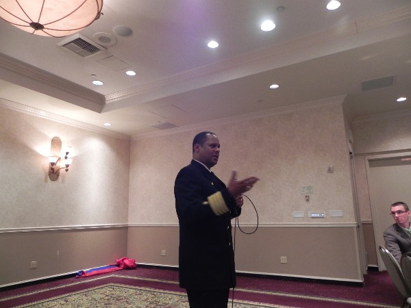 Capt. Gary Mayes, USN, commanding officer of Naval Air Station North Island, speaks to the chapter's February luncheon crowd.